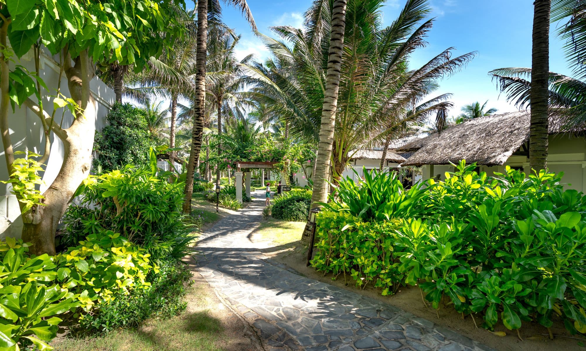 A private luxury villa glowing at dusk in the Belizean jungle at Villa Massis